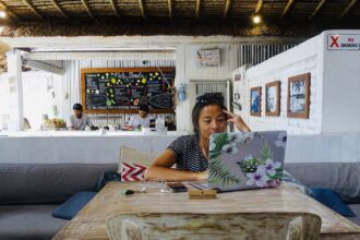 Remote worker with laptop travelling