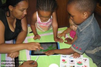 Parent and child using a tablet at home