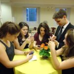 A young person watching videos on a smartphone