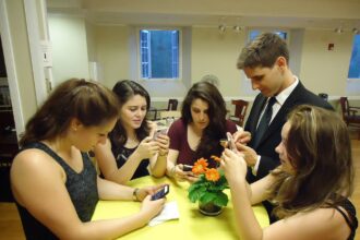 A young person watching videos on a smartphone