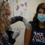 A mother and child at a doctor appointment for vaccination