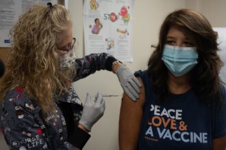 A mother and child at a doctor appointment for vaccination