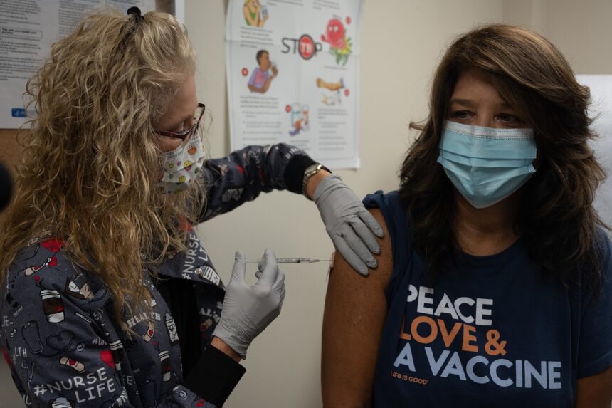 A mother and child at a doctor appointment for vaccination